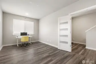 This flexible room behind elegant French doors is perfect as a home office, guest retreat, playroom, or cozy reading nook. The possibilities are wide open.