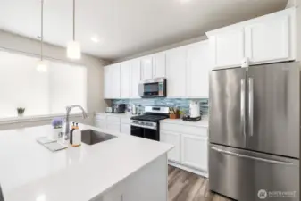With a spacious island, modern appliances, and stylish finishes, this thoughtfully designed kitchen is ready for everything from weeknight meals to weekend entertaining.