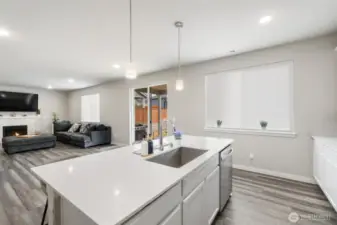 Enjoy effortless connection from the kitchen to the great room and out to the covered patio, blending indoor comfort with outdoor living in true Northwest style.