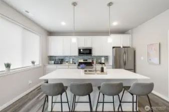 This oversized island with seating for four is the perfect hub for morning coffee, casual meals, or connecting while you cook.