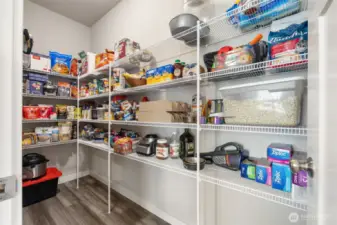 Spacious and practical, this walk-in pantry offers plenty of room for groceries, gadgets, and everything in between — a true kitchen upgrade.