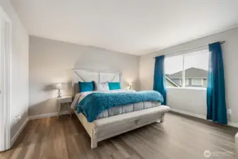 The spacious primary suite offers peaceful vibes, soft natural light, and plenty of room to unwind in comfort and style.