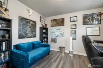 Closet? Office? Why not both.  Tucked away behind the primary suite, this flexible space adds surprising function with room for a desk, seating, and inspiration to spare.