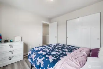 Thoughtfully placed and full of natural light, this secondary bedroom balances coziness with plenty of elbow room.