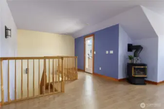 Lets go upstairs and see this wonderful space.  Door leads to private balcony.  Nice propane stove for separate heating if wanted