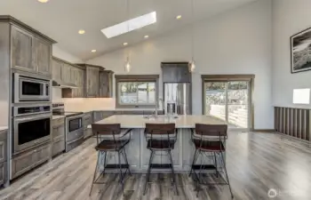 Kitchen island with seating and river views, perfect for entertaining.