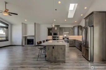 Beautiful wood cabinets with stainless appliances and gorgeous quartz countertops.