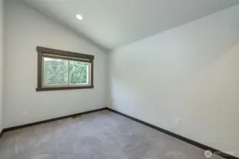 Third bedroom upstairs offering flexible space for guests or home office.