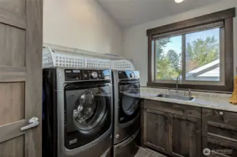 Laundry located upstairs with 3 bedrooms & 2 full bathrooms