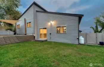 Large green lawn with irrigation & paver patio for entertaining