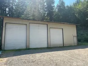 Huge "King Cave" with 2 RV size doors and 200 amp service. Water is stubbed out, just out side the building if needed.