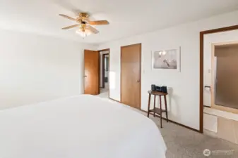 Primary suite with slight ai modification to bedspread and removed furnishings