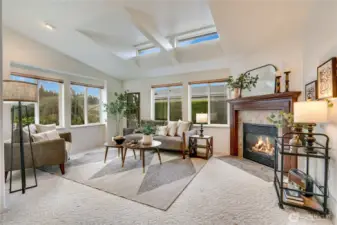 Formal living room with fireplace and beautiful wood mantle.