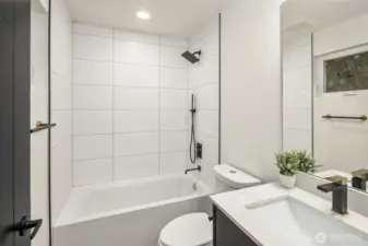 Main floor full bath  *Photos are of 8513A which features a similar floor plan