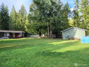 The original owner was very smart in where the house was situated as you have this phenomenal view of the yard with your garage and shop plus the sheds and open lawn space!