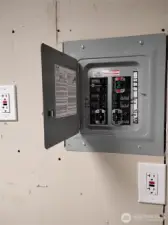 The shop has an electrical panel just for all the circuits inside plus there is an outlet outside.