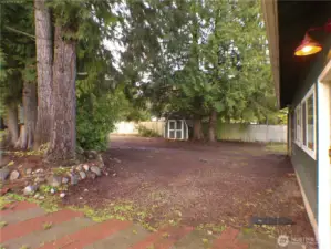 Very wide parking area in front of the garage and along the wide, private driveway