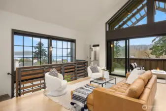 Penthouse-inspired top-level with soaring vaulted ceilings and an open-concept living, kitchen, and dining space, perfect for effortless entertaining!