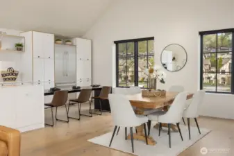 A custom steel table anchored to the island extends dining space for your guests