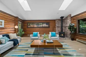 With a standing, brick wood-burning fireplace, this living room is cozy cabin vibes!