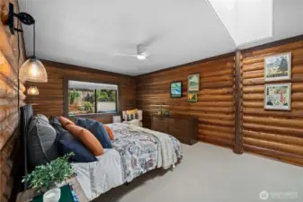 Spacious bedroom no. 1 with a large window, funnels in tons of natural light.