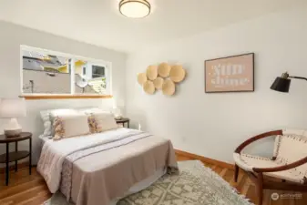 Bedrooms on the main floor include hardwood floors and large closets.