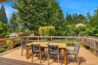 Large deck overlooks the back yard, perfect for indoor/outdoor entertaining.
