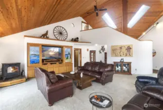 Custom in nearly every way with warm wood finishes and voluminous great room.