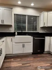 Kitchen has upgraded Apron-Front Farm House Sink with metal grid.