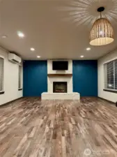 Living Room has Electric Fireplace and upgraded brick exterior and Mantle.