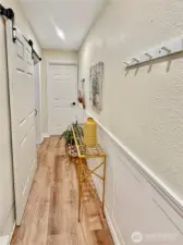 The hall just off the garage offers access to both the main floor and lower level.