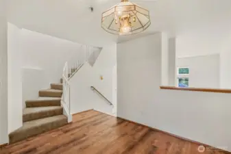 Mezzanine dining formal dining room with spiral staircase to bedrooms.