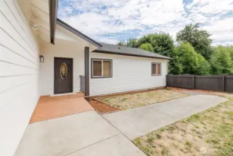 Welcoming covered entryway with easy access to the garage and home