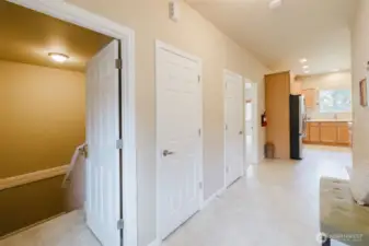 Wide hallway with easy access to bedrooms and bathrooms