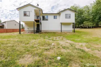 Side view of home with fully fenced yard