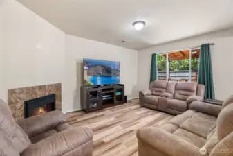 Cozy up by the electric fireplace.
