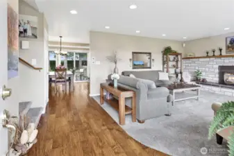 The moment you step inside, you’re welcomed by a bright and inviting living room centered around a cozy gas fireplace. Every detail of this home has been meticulously maintained, creating a warm and comfortable first impression.
