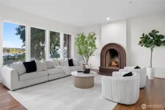 The kitchen flows seamlessly into the living room, complete with a brick gas fireplace to stay warm while watching boats on the water