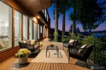 An expansive deck along the main floor offers outdoor entertaining with views