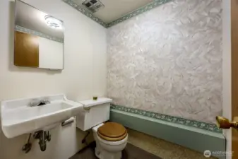 Powder room off bonus room.