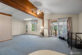 Living room has a slider that goes to the sunroom.  Spiral staircase takes you downstairs