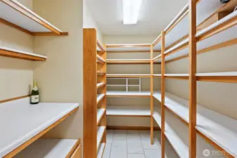 Pantry conveniently positioned off the kitchen, offering ample storage space.