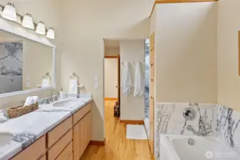 Primary bathroom with thoughtfully designed pocket-door water closet, accessible from both the suite and guest areas.