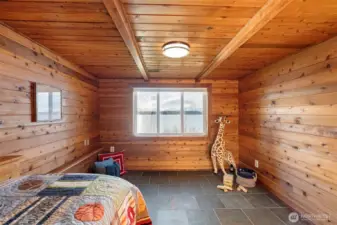 First bedroom in the daylight basement offering comfort and privacy.