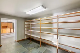 Hallway with ample built-ins flowing into a flexible craft or hobby room.