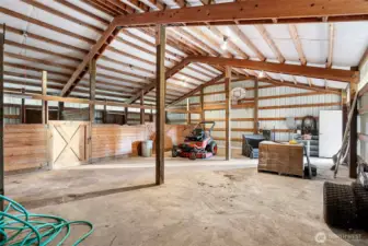 Barn with 3 stalls, providing versatile space for livestock or storage.