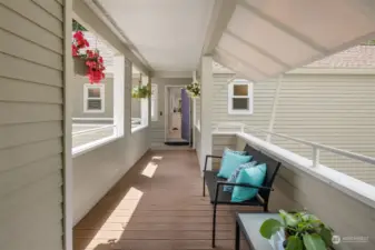 Covered walkway has low-maintenance decking and a shaded bump-out (for escaping the sunnier South balcony).