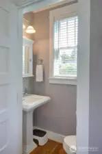 Off the back entry is small powder room.