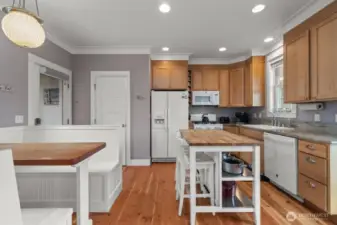The natural cabinets and wood floors are neutral and warm.  The wood floors are scheduled to be refinished this summer!