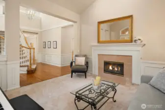 A cozy yet sophisticated living room, perfectly complemented by a warm and inviting gas fireplace.